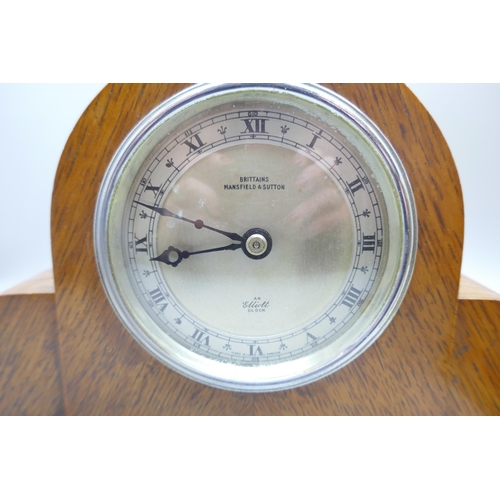 627 - Two clocks; oak cased Elliott and brass Rapport