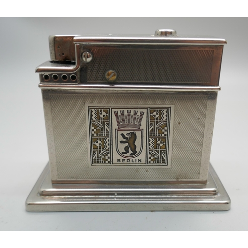 652 - A German table lighter, machined turn front and Berlin motif