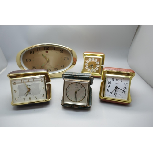 654 - Four travel clocks and a retro Chinese clock