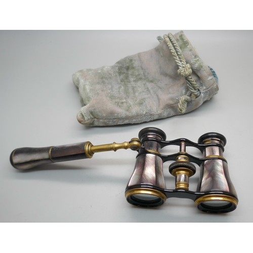 659 - A pair of mother of pearl and gilt brass opera glasses with extending handle