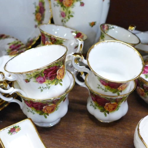 676 - Royal Albert Old Country Roses; six dinner plates, two bread and butter plates, a vase and two posy ... 