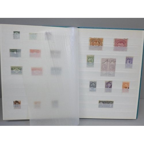 685 - Stamps; a stock book of GB and World Revenue stamps, including entire documents