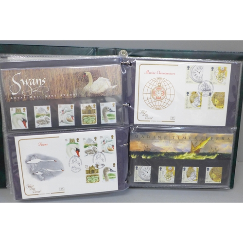 692 - Stamps; an album of GB first day covers and presentation packs from the period June 1990 to July 199... 