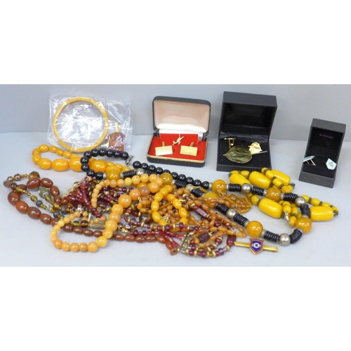 698 - Costume jewellery, cufflinks, rings, amber coloured beads, etc.