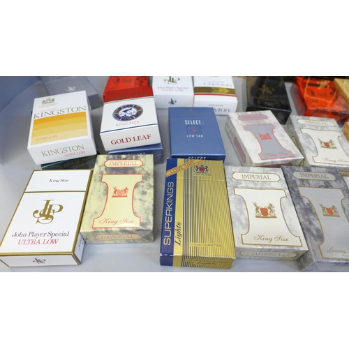 699 - A collection of forty-three sealed and cellophane wrapped dummy cigarette packs from Imperial Tobacc... 