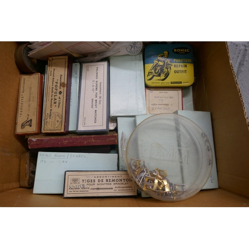 701 - Two boxes of watch materials including main springs, crowns, rotor wheels, etc. **PLEASE NOTE THIS L... 