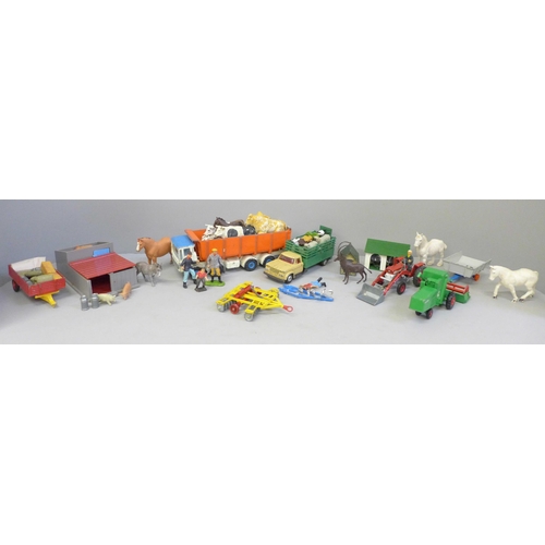 713 - A collection of farmyard models and vehicles, animals, etc.