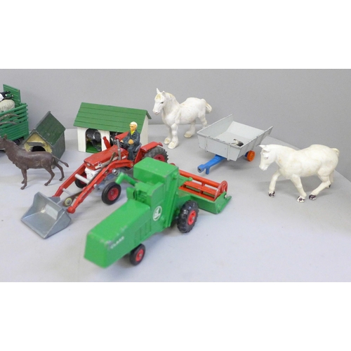 713 - A collection of farmyard models and vehicles, animals, etc.