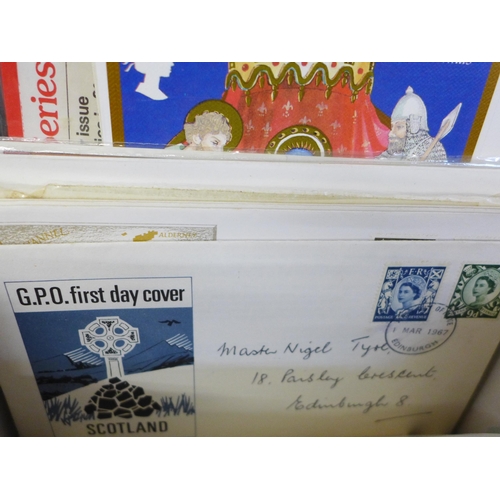 714 - Stamps; a box of stamp albums, covers, presentation packs, etc.