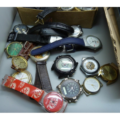 718 - A collection of wristwatches including boxed Swatch and other Swatch watches