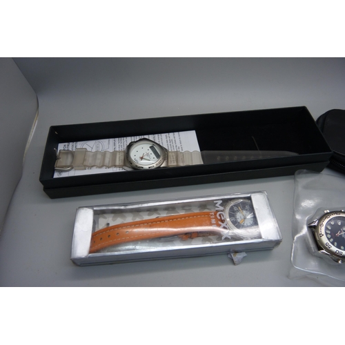 718 - A collection of wristwatches including boxed Swatch and other Swatch watches