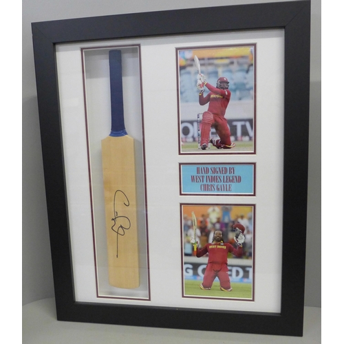 760 - A presentation framed mounted cricket bat, signed by West Indies legend Chris Gayle