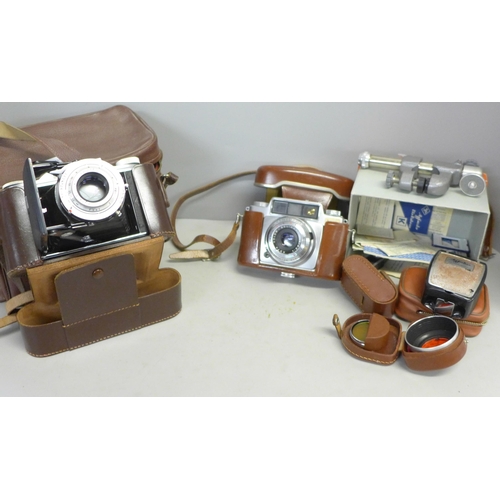 793 - An Agfa Record folding camera, one other Agfa camera and camera accessories