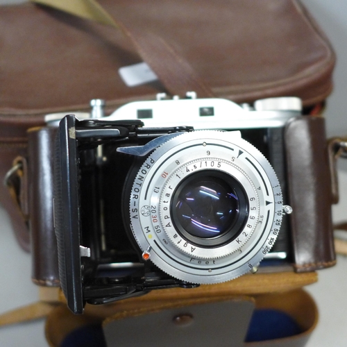 793 - An Agfa Record folding camera, one other Agfa camera and camera accessories