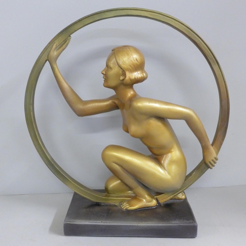 817 - An Art Deco style lady in ring (hoop girl) figure on base, after Leonardi, 29cm