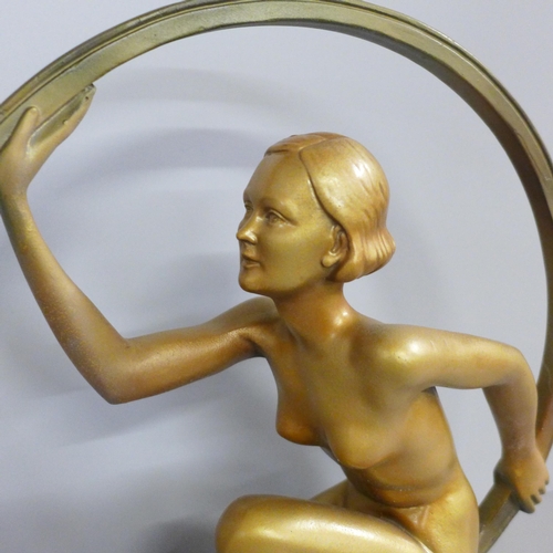 817 - An Art Deco style lady in ring (hoop girl) figure on base, after Leonardi, 29cm