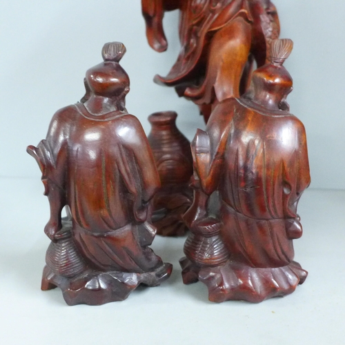 819 - Two pairs of Chinese hardwood carved figures, tallest 31cm, one lacking staff