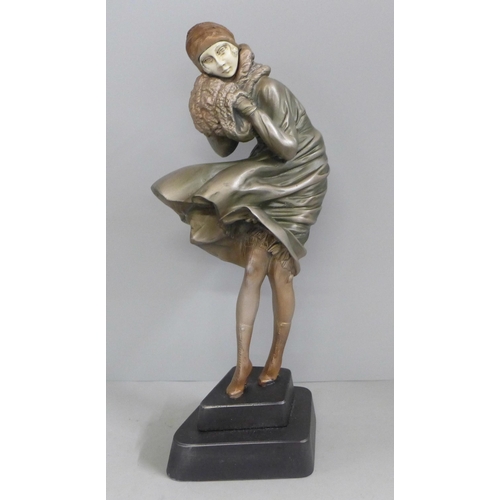 823 - An Art Deco style figure 'Windswept' lady in the wind, after Chiparus, 31cm