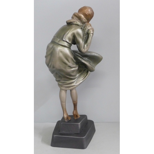 823 - An Art Deco style figure 'Windswept' lady in the wind, after Chiparus, 31cm