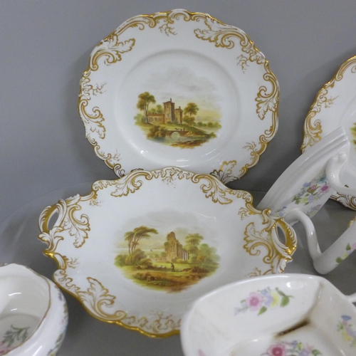 825 - A four setting dessert service and two bread and butter serving plates, each decorated with landscap... 