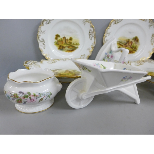 825 - A four setting dessert service and two bread and butter serving plates, each decorated with landscap... 