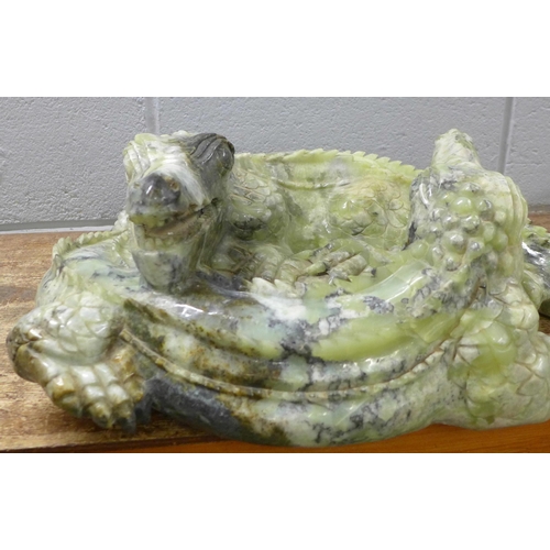 827 - A large carved Chinese jade model of two entwined crocodiles, tail and back claw a/f, 66cm, 35kg **P... 