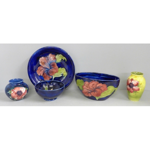 832 - Five items of early 20th Century Moorcroft china, two vases, two bowls and a dish; Hibiscus, Orchid ... 