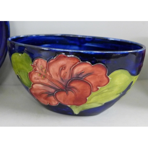 832 - Five items of early 20th Century Moorcroft china, two vases, two bowls and a dish; Hibiscus, Orchid ... 