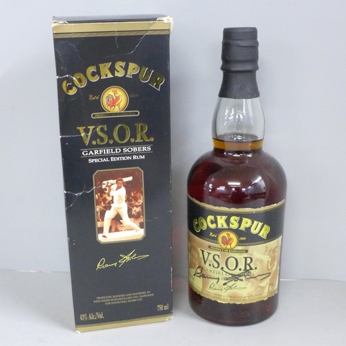 838 - A bottle of Cockspur V.S.O.R. Special Edition Garfield Sobers Rum hand signed on the label by Garfie... 