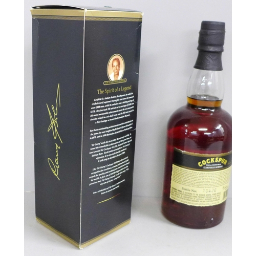 838 - A bottle of Cockspur V.S.O.R. Special Edition Garfield Sobers Rum hand signed on the label by Garfie... 