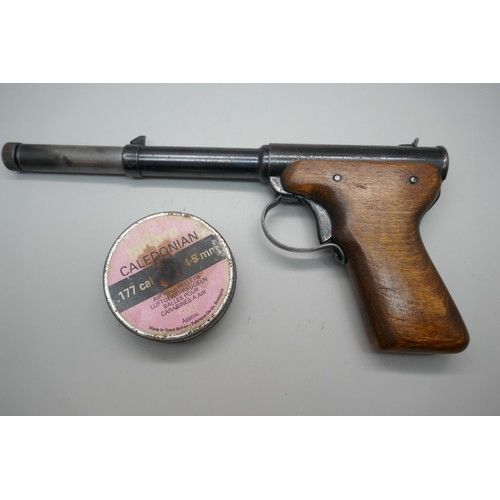 851 - A Diana Model 2, .177 target shooting air pistol, 1953, with a tin of pellets