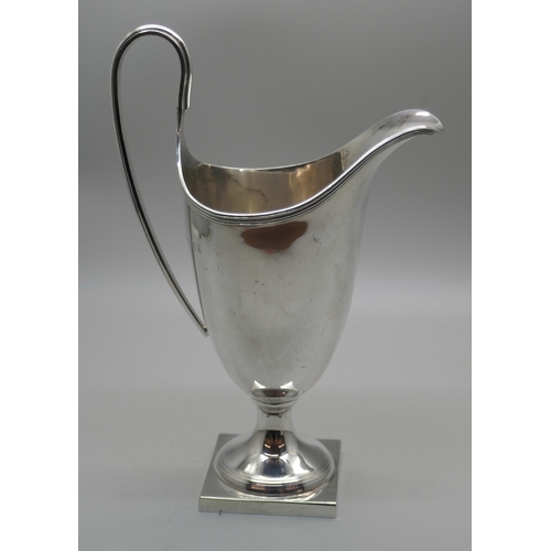 863 - A silver helmet shaped jug, 128g