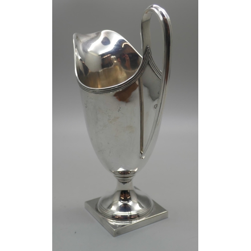 863 - A silver helmet shaped jug, 128g