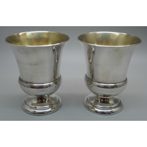 864 - A pair of small American silver goblets with gilt interiors, 137g, marked International Sterling