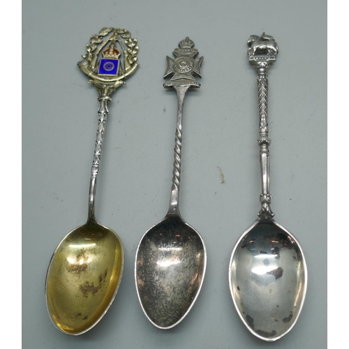 870 - Two silver regimental spoons and a silver and enamel rifle shooting spoon, 48g