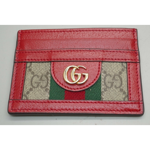 876 - A Gucci leather card holder