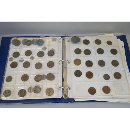 897 - An album of British and foreign coins including a 1797 cartwheel penny, some silver coins, Queen Vic... 