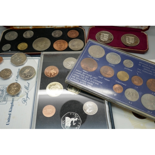 910 - Eight UK mint coin sets, EIIR 1965 set, 1986 set, 1984 set, etc.