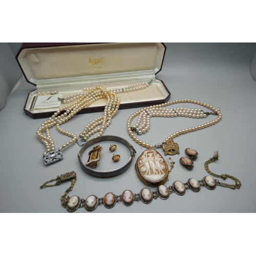 915 - A 9ct gold cameo brooch, 14.5g, a silver bangle, faux pearls, etc.