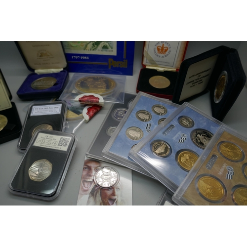 917 - Fifteen commemorative coin sets, medallions and a £1 note, including 50th Anniversary Operation Dyna... 