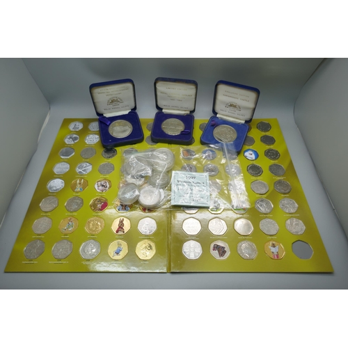 930 - A silver proof Samoa $2 1997, with certificate, nine others, three nickel silver crowns, cased, a £5... 