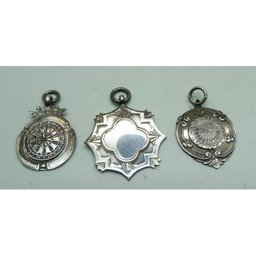 940 - Three silver fob medals including two darts, 18g