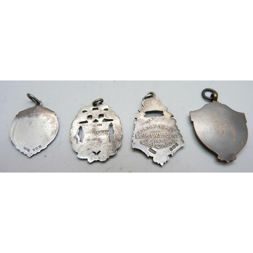 942 - Three silver fob medals including one with gold applied plaque, 21g, and one other fob medal