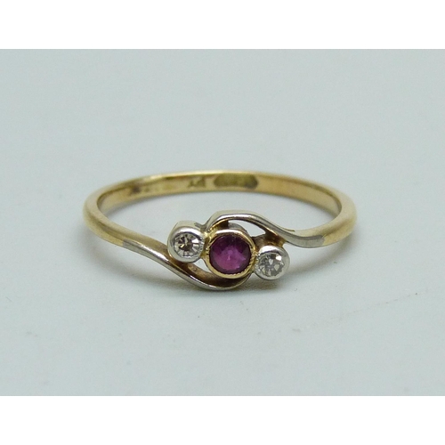 945 - An 18ct gold, ruby and diamond three stone ring, 1.5g, K/L