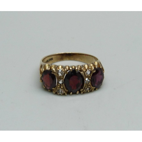 952 - A silver gilt and garnet ring, Q