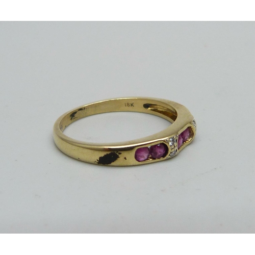 956 - An 18ct gold, ruby and diamond ring, 2.8g, O