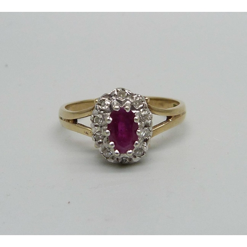 957 - A 9ct gold, ruby and diamond cluster ring, 2.5g, M