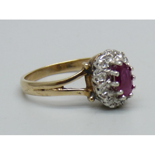 957 - A 9ct gold, ruby and diamond cluster ring, 2.5g, M