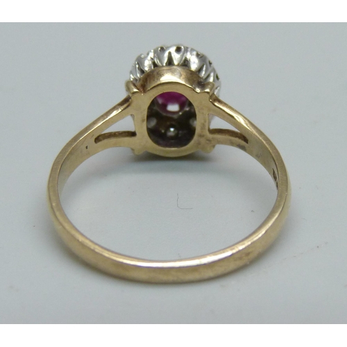 957 - A 9ct gold, ruby and diamond cluster ring, 2.5g, M