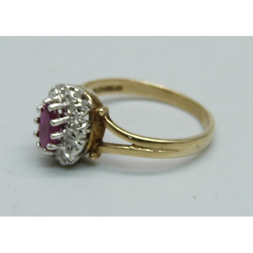 957 - A 9ct gold, ruby and diamond cluster ring, 2.5g, M